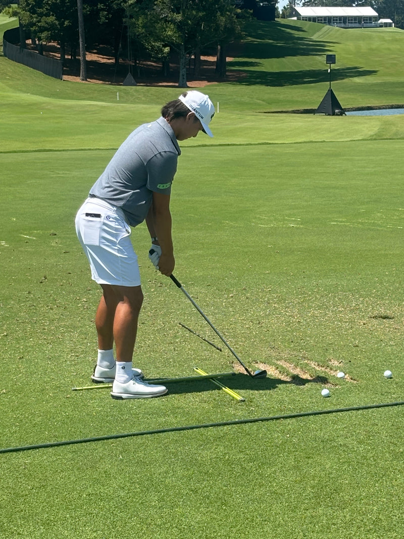 Min Woo Lee with Practice T on the green